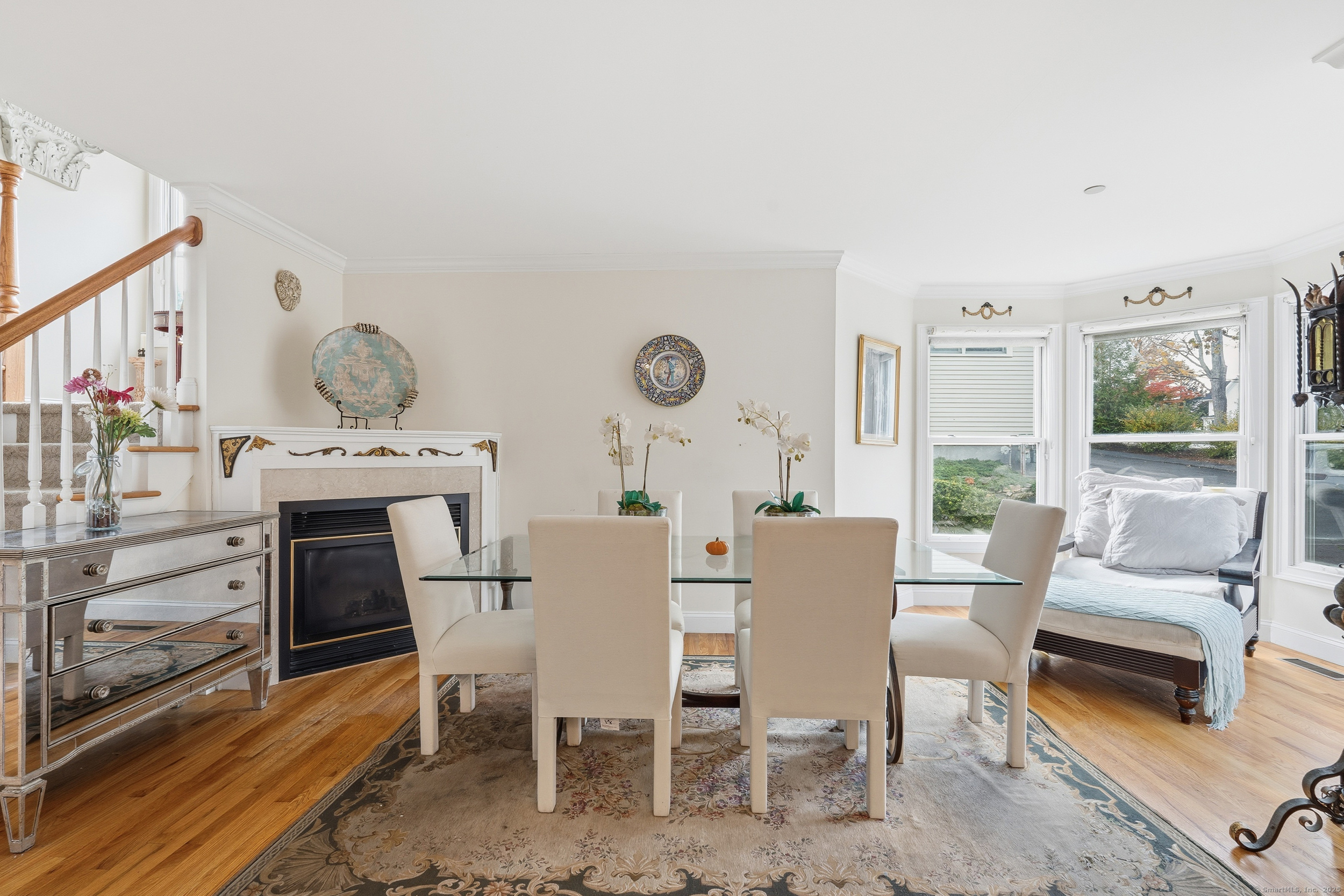 59 Prospect Street, Unit C Ridgefield, CT 06877 - Photo 8 of 38 a dining room with furniture and wooden floor