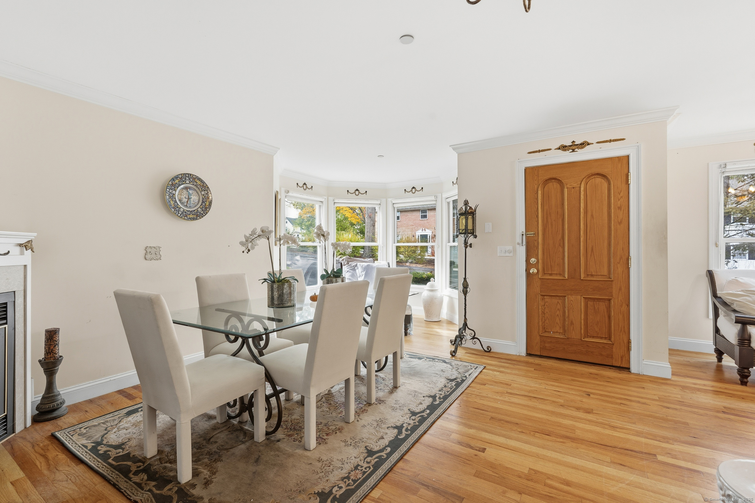 59 Prospect Street, Unit C Ridgefield, CT 06877 - Photo 9 of 38 a view of a dining room with furniture and wooden floor