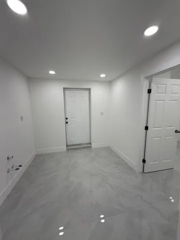 a bathroom with a toilet a sink and bathtub