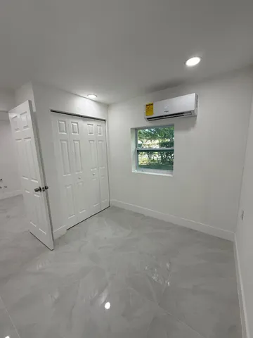 a bathroom with a toilet a sink and shower