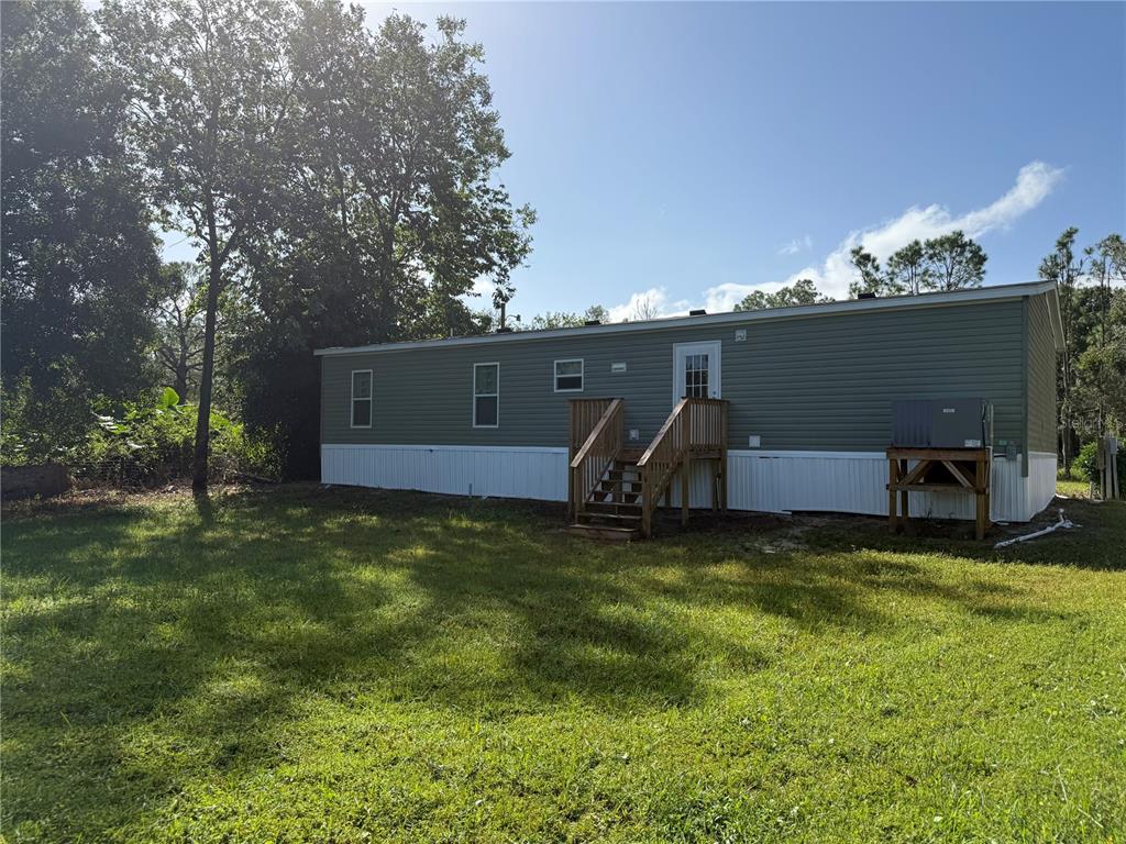 1561 Poe Road Lake Wales, FL 33898 - Photo 14 of 15 a view of a outdoor space with a car park