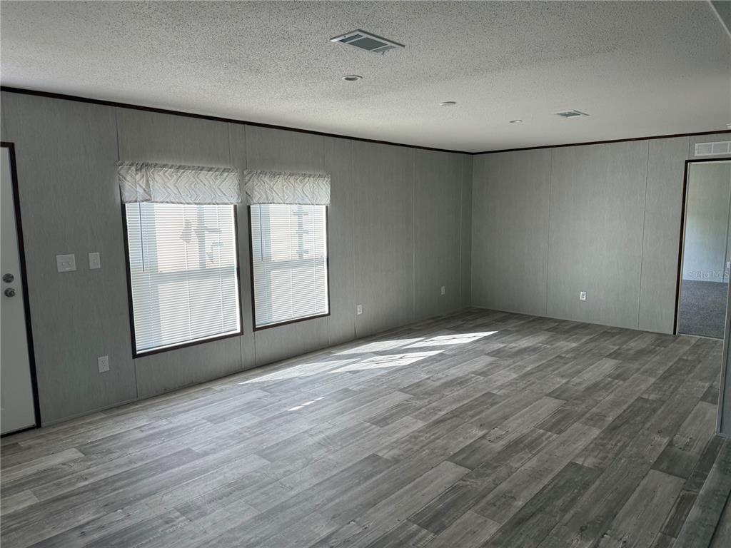 1561 Poe Road Lake Wales, FL 33898 - Photo 2 of 15 a view of empty room with wooden floor