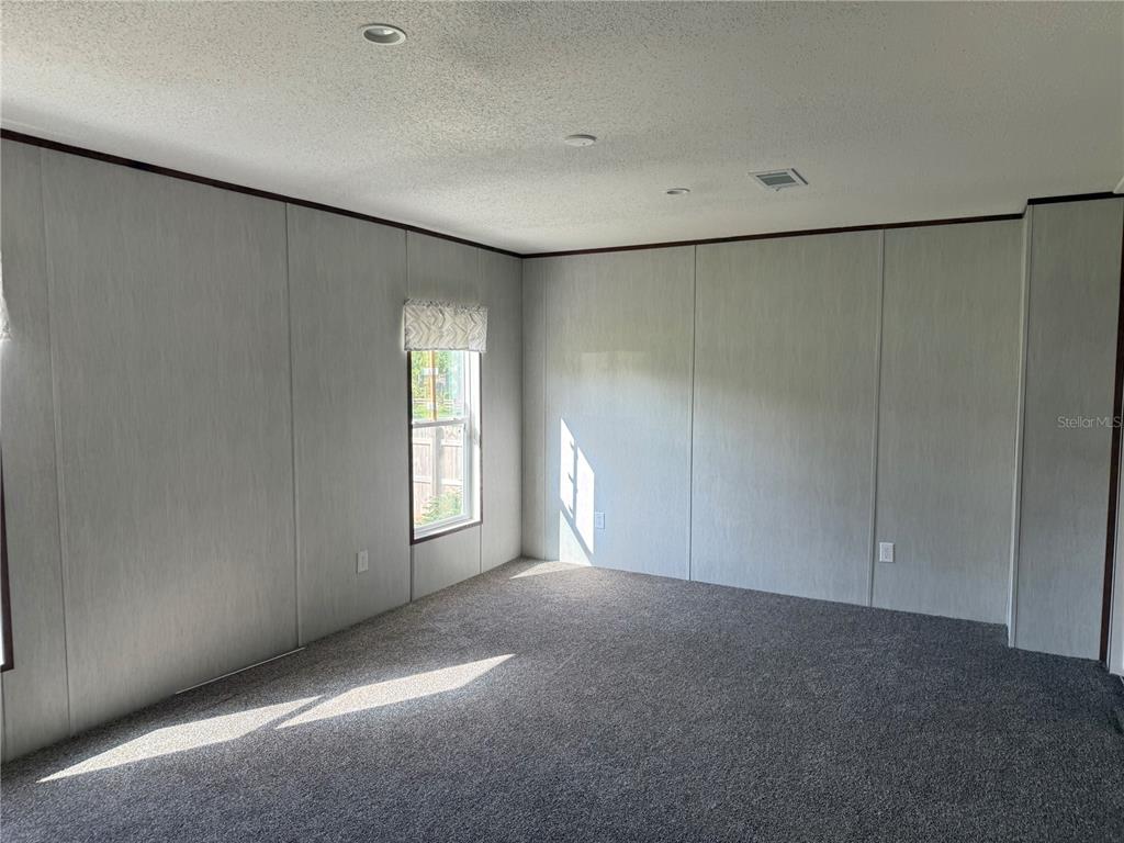 1561 Poe Road Lake Wales, FL 33898 - Photo 8 of 15 a view of an empty room with windows