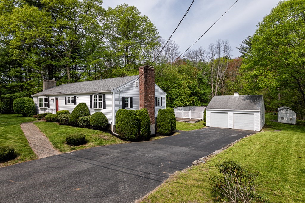 113 Newbury Road Rowley, MA 01969 - Photo 2 of 26 a front view of a house with garden