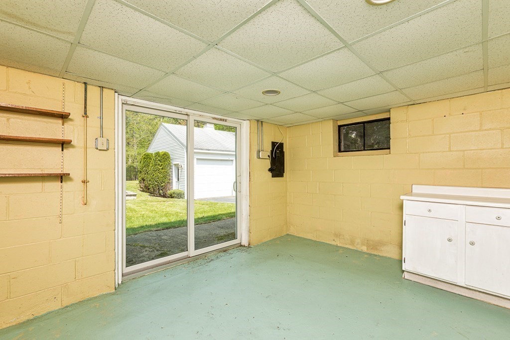 113 Newbury Road Rowley, MA 01969 - Photo 21 of 26 a view of a livingroom with wooden floor and cabinet