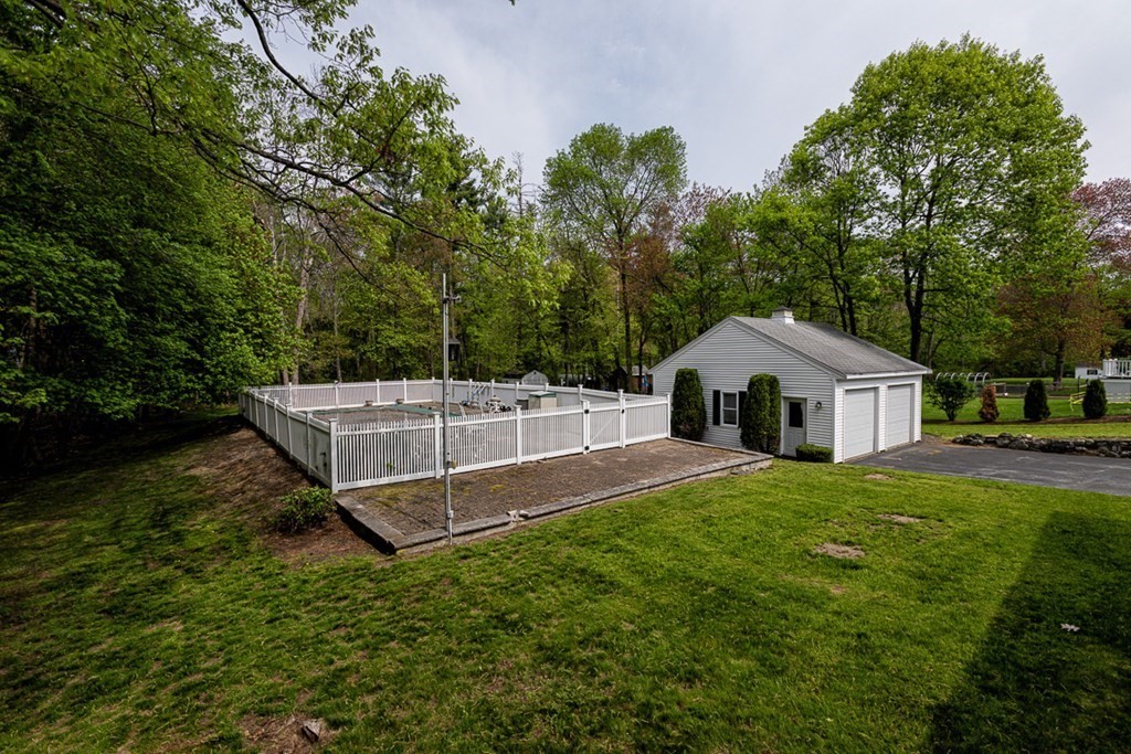 113 Newbury Road Rowley, MA 01969 - Photo 6 of 26 a house view with a garden space