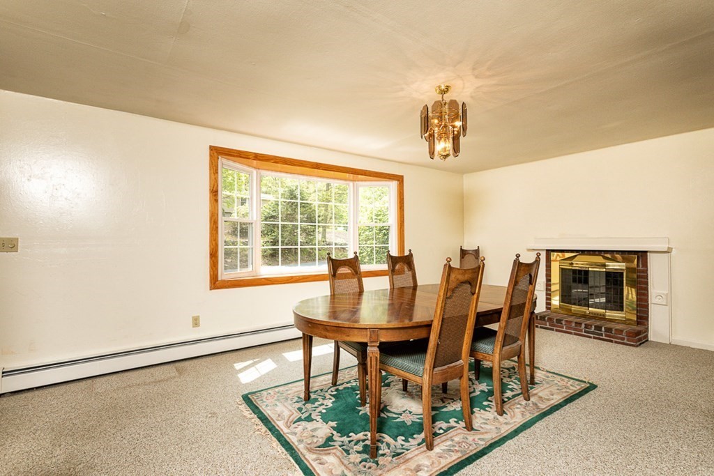 113 Newbury Road Rowley, MA 01969 - Photo 10 of 26 a dining room with furniture and window