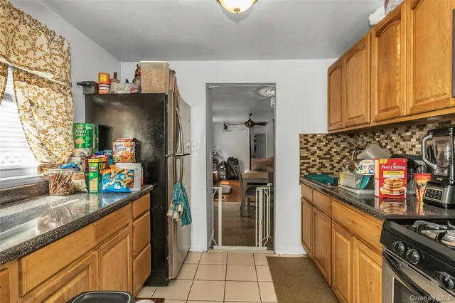 a kitchen with stainless steel appliances a refrigerator and a stove