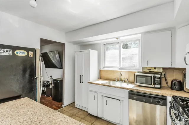 a kitchen with a stove and a refrigerator
