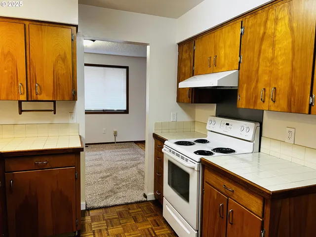 a kitchen with a stove and a sink