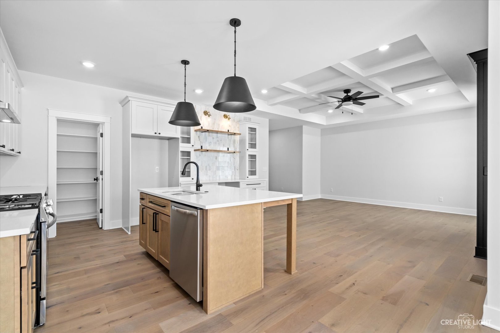 665 Ivan Drive Sycamore, IL 60178 - Photo 11 of 30 a kitchen with kitchen island a sink appliances and cabinets