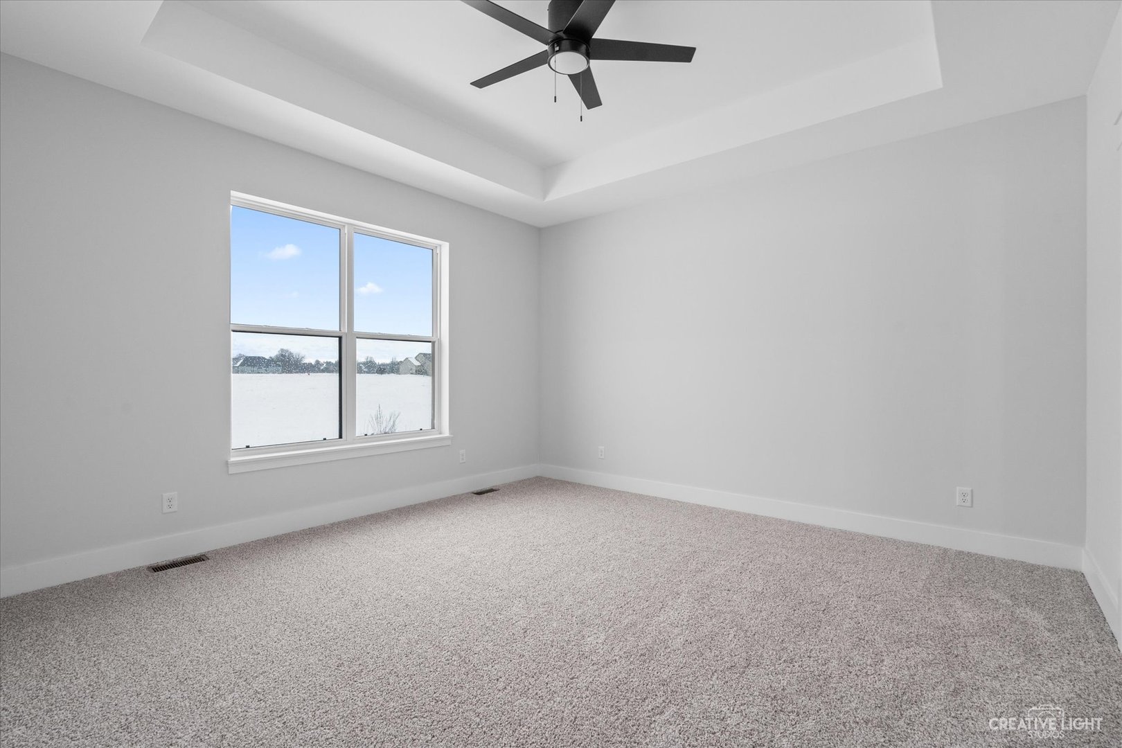 665 Ivan Drive Sycamore, IL 60178 - Photo 14 of 30 an empty room with a window and a fan