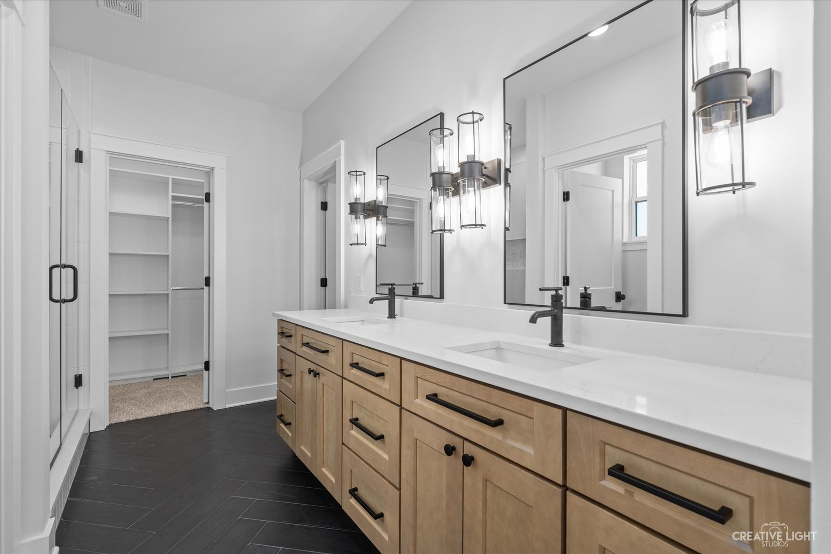 665 Ivan Drive Sycamore, IL 60178 - Photo 16 of 30 a spacious bathroom with a granite countertop sink mirror and shower