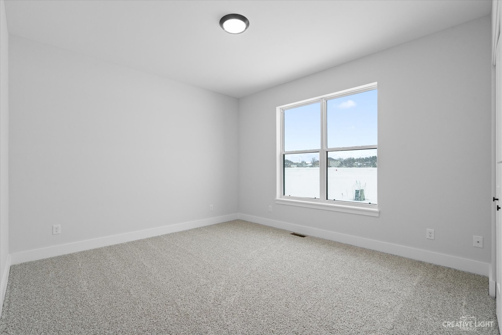 665 Ivan Drive Sycamore, IL 60178 - Photo 20 of 30 an empty room with a window