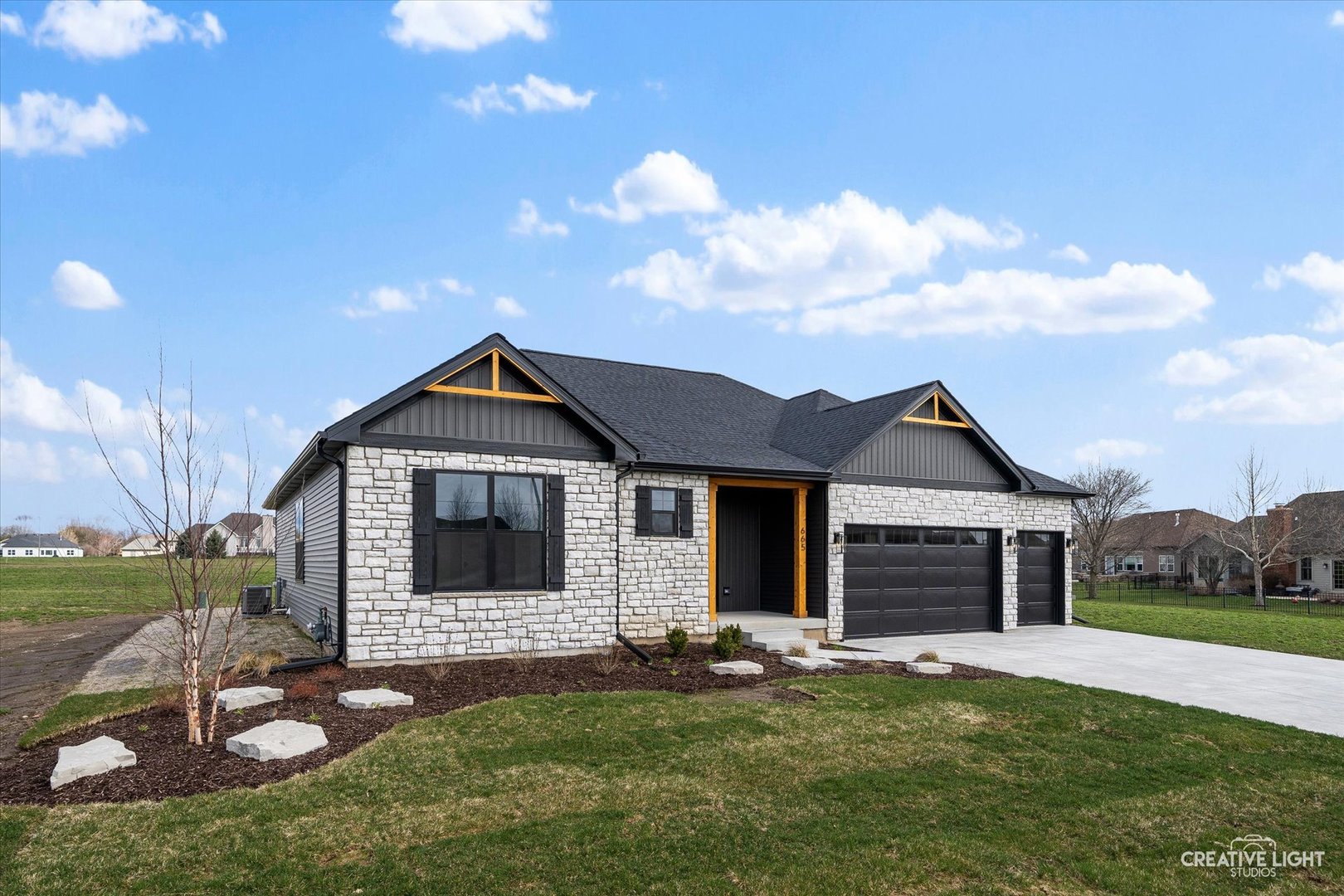 665 Ivan Drive Sycamore, IL 60178 - Photo 2 of 30 a front view of a house with a yard