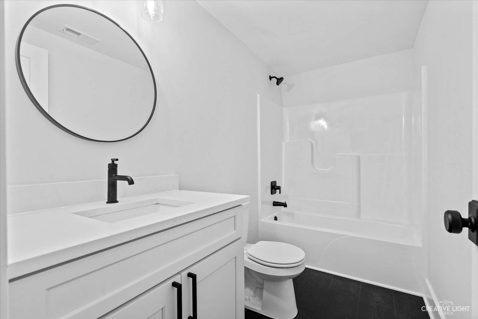 665 Ivan Drive Sycamore, IL 60178 - Photo 25 of 30 a bathroom with a sink a toilet and a mirror