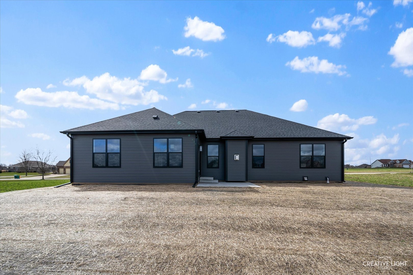 665 Ivan Drive Sycamore, IL 60178 - Photo 29 of 30 a front view of house with yard and mountain view in back