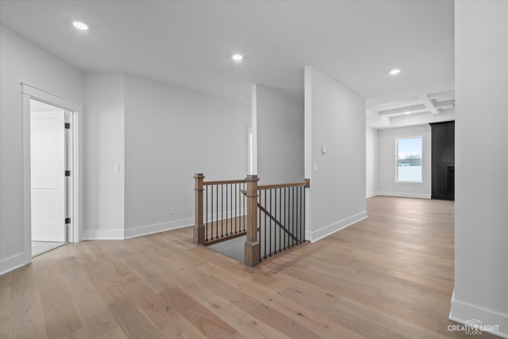 665 Ivan Drive Sycamore, IL 60178 - Photo 4 of 30 a view of a hallway with wooden floor