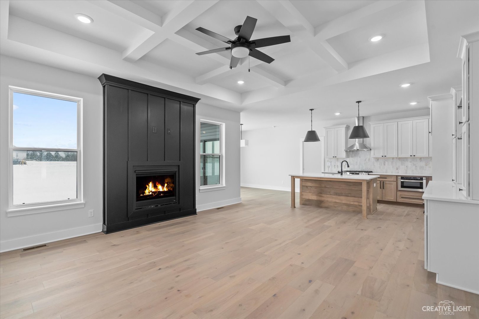 665 Ivan Drive Sycamore, IL 60178 - Photo 6 of 30 an empty room with kitchen and fireplace