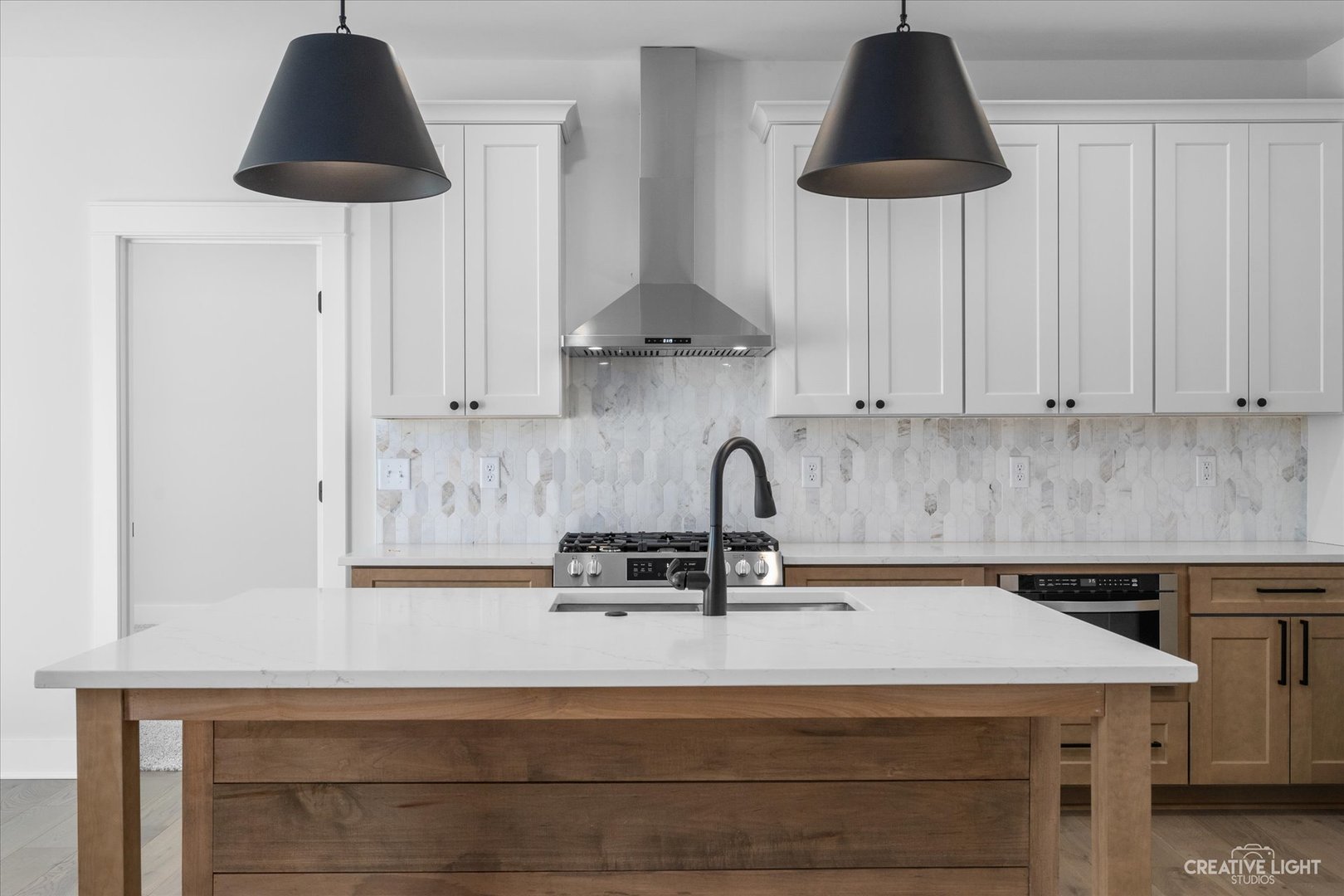 665 Ivan Drive Sycamore, IL 60178 - Photo 9 of 30 a kitchen with a sink cabinets and a stove