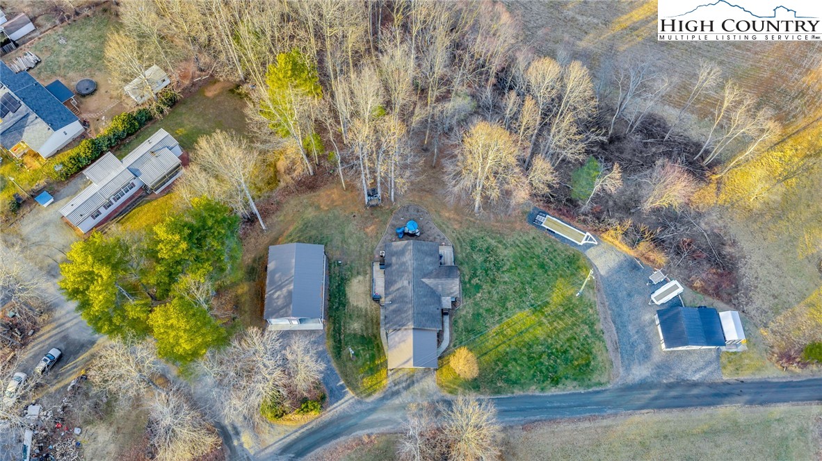 747 Nathans Creek School Road Crumpler, NC 28617 - Photo 3 of 42 an aerial view of a house with a yard basket ball court