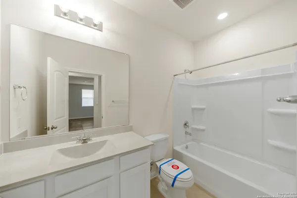 a bathroom with a sink a toilet and a bathtub