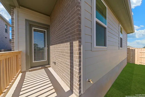 a view of a house with a door and a window