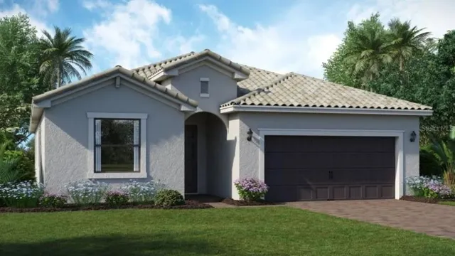 a front view of a house with a garden and plants