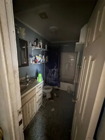 a kitchen with sink and refrigerator