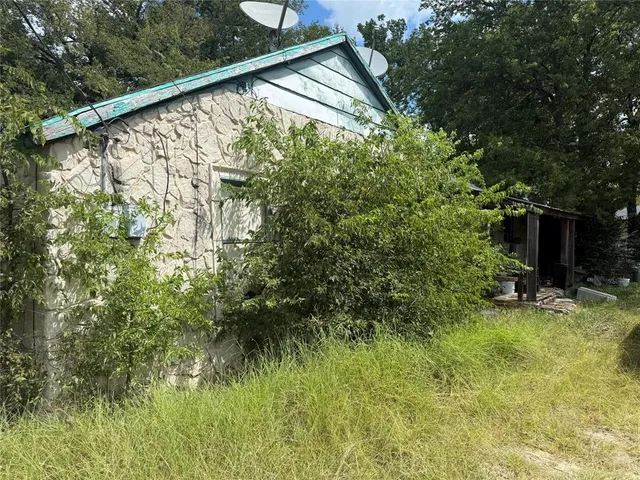 a view of a backyard of the house
