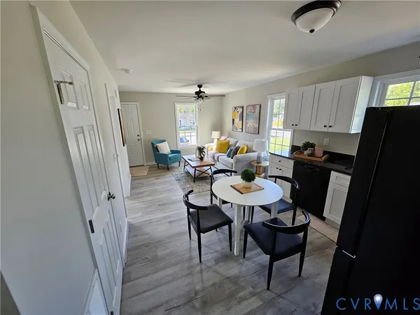 a view of a dining room with furniture window and wooden floor