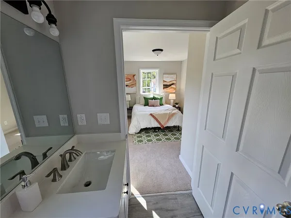 a bathroom with a sink and mirror