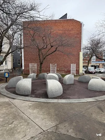a couple of potted plants sitting in middle of a building