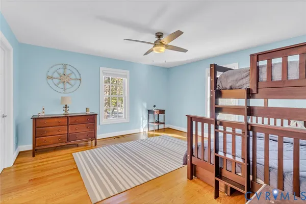 a bedroom with furniture and a window