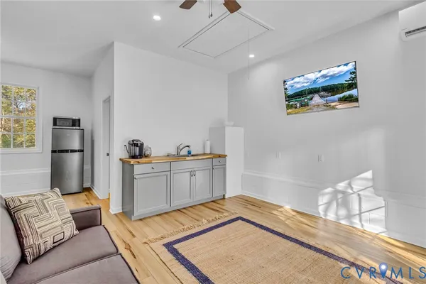 a bedroom with a bed and a couch