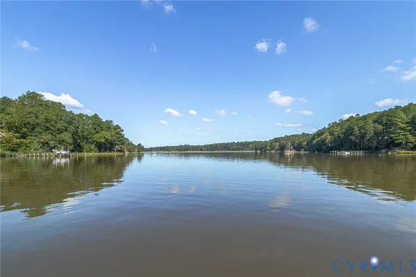 a view of a lake with sitting area