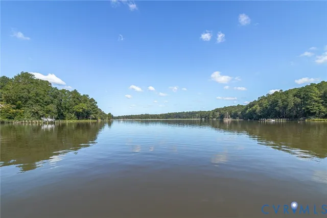 a view of a lake with sitting area