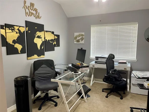 a work room with furniture and wooden floor