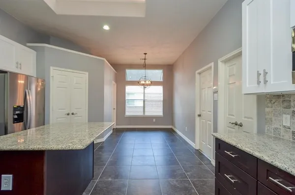 a kitchen with stainless steel appliances granite countertop a sink and cabinets