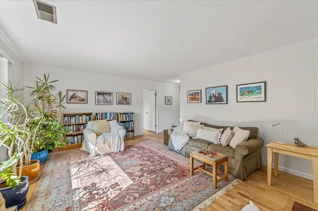 a living room with a couch and a table