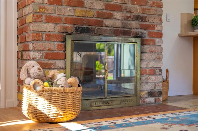 a bathroom with a granite countertop toilet a sink and a mirror