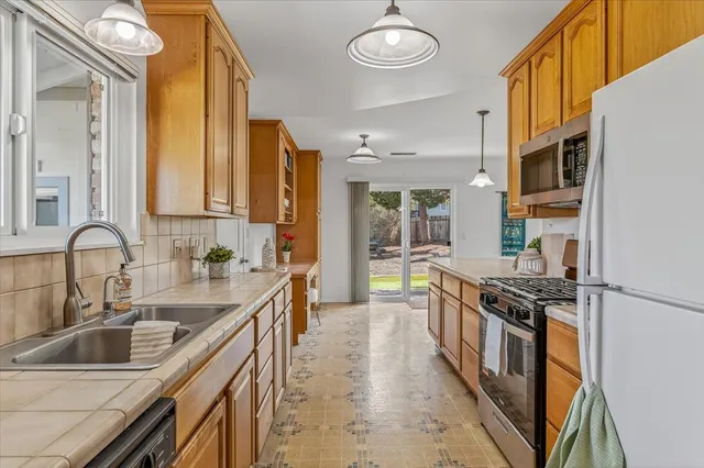 a bathroom with a sink a vanity and a shower