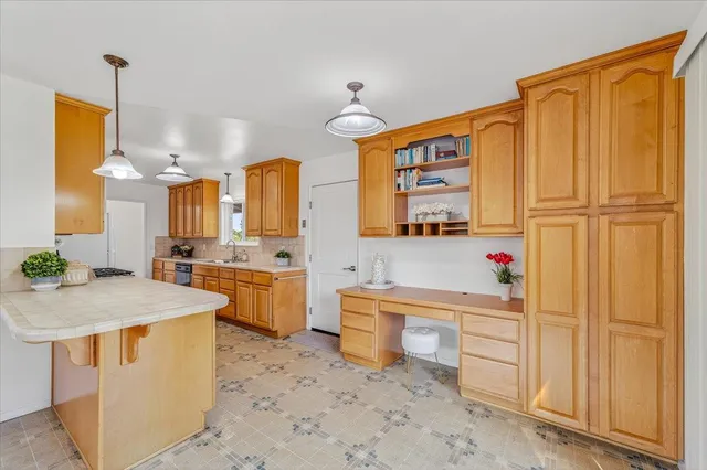 a workspace with furniture and a window