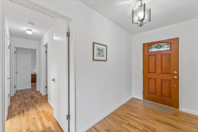 a view of a room that has a bed in it