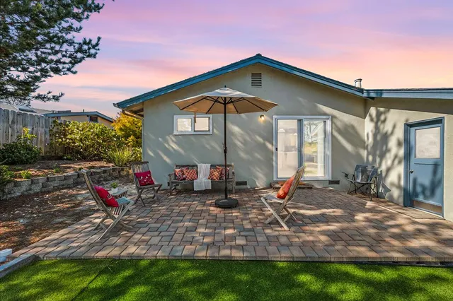 aerial view of a house with swimming pool and outdoor seating