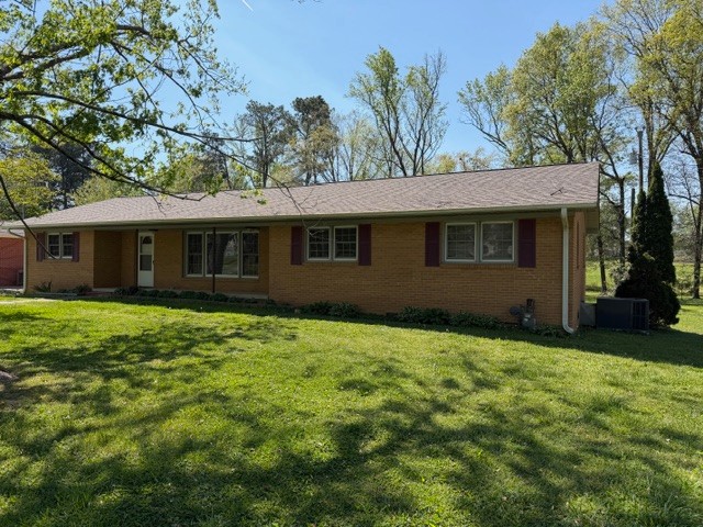 12 Perkins Road Fayetteville, TN 37334 - Photo 2 of 25 a house with huge green field in front of it