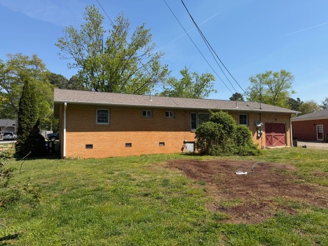 12 Perkins Road Fayetteville, TN 37334 - Photo 3 of 25 a front view of a house with a yard and garage