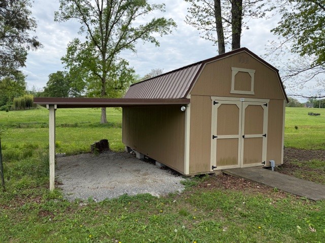 12 Perkins Road Fayetteville, TN 37334 - Photo 7 of 25 a front view of a house with garden