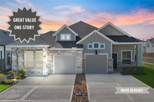 a front view of a house with a garage