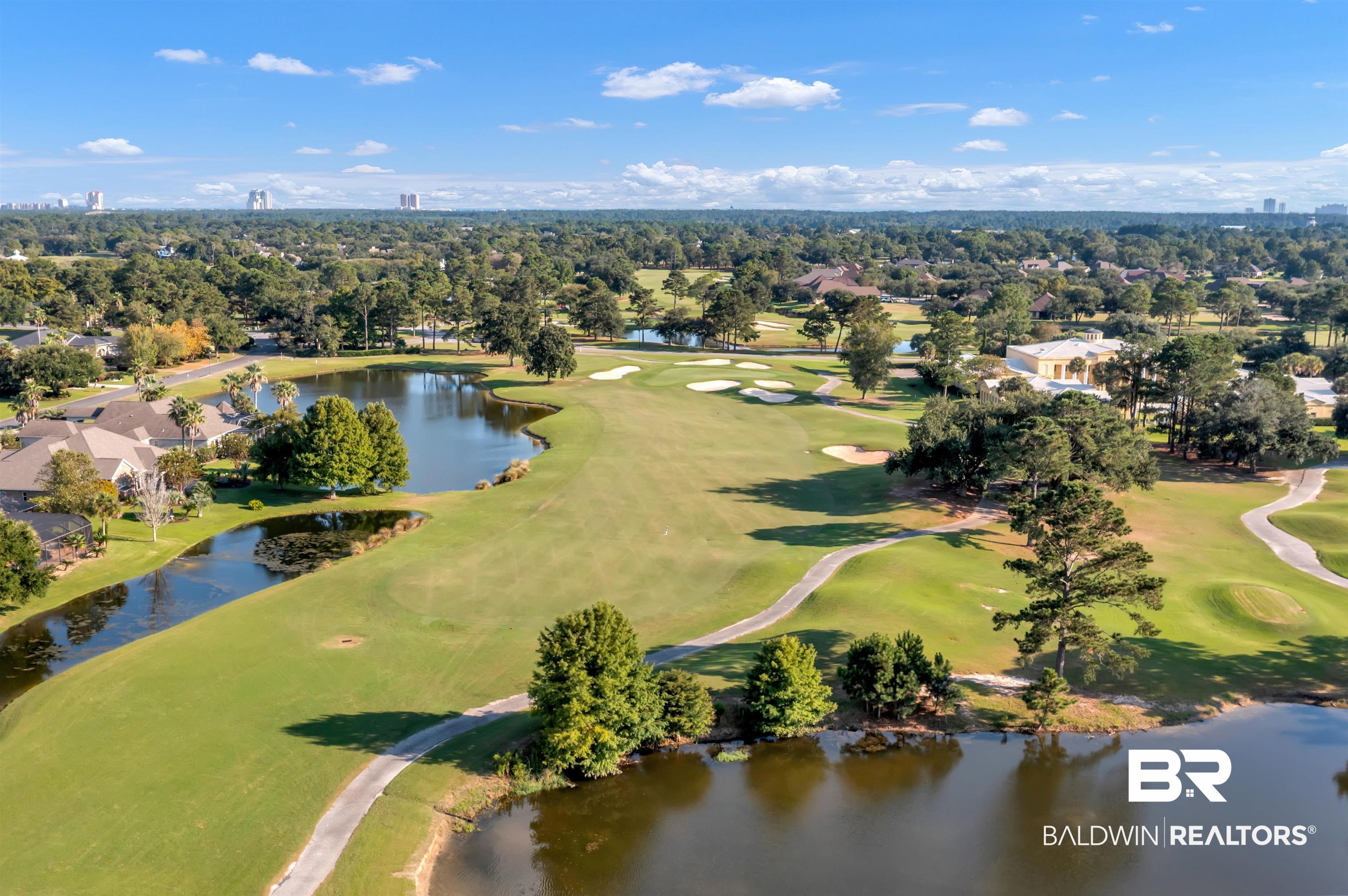 Lakes Circle Gulf Shores, AL 36542 - Photo 9 of 15 Aerial view of residential area with a nearby body of water and a local golf course
